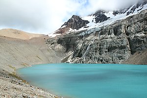 The mountain lake being fed with glacier water.