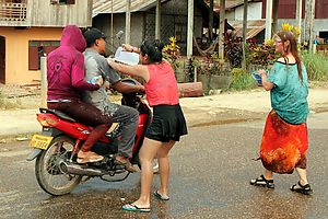 Motorcyclists getting wet.