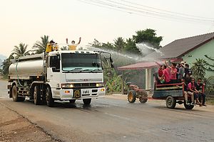 Water play: a big truck versus a group in a small dtokdtok.