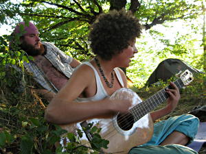 Ola playing guitar in the Polish camp.