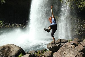 Sandra taking a look at a waterfall by the Diguillio river.