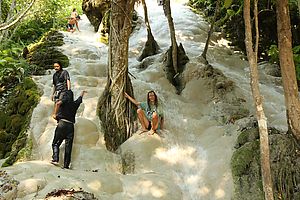 Arto sitting in the middle of the Bua Tong waterfall, Thailand.