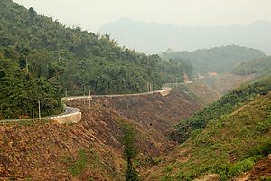 A mountain road near Na Mor, Oudomxay, Laos. Visibility reduced due to the misty air.